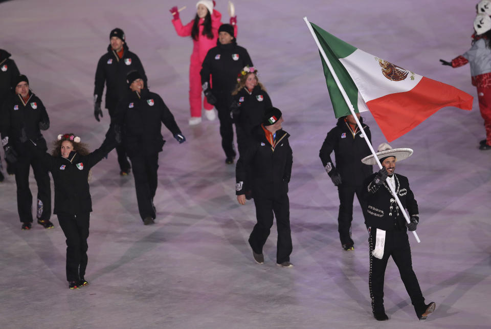 <p>German Madrazo carries the flag of Mexico during the opening ceremony of the 2018 Winter Olympics in Pyeongchang, South Korea, Friday, Feb. 9, 2018. (AP Photo/Michael Sohn) </p>