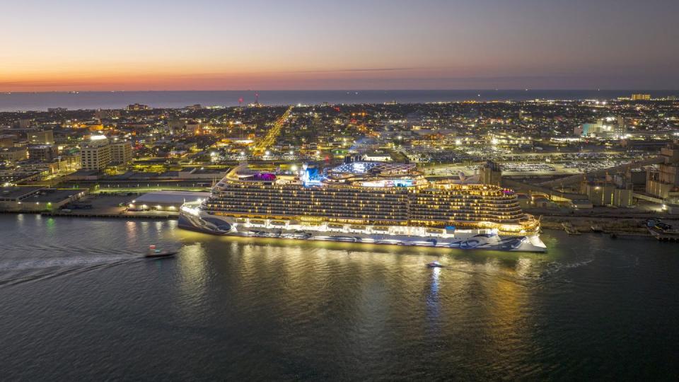 a norwegian cruise lines cruise ship in the water at night