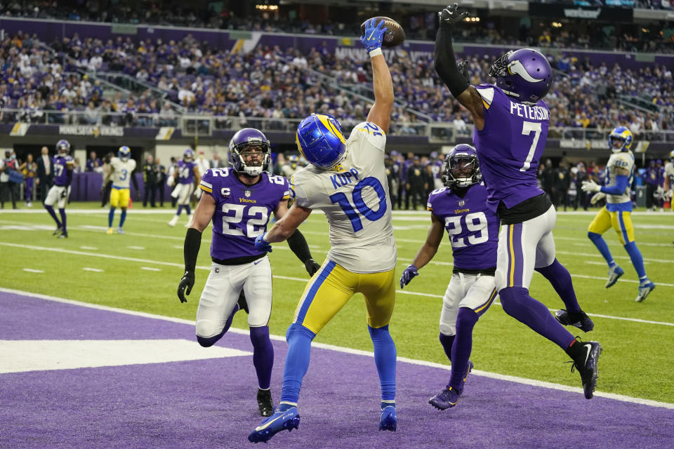Minnesota Vikings cornerback Patrick Peterson (7) breaks up a pass intended for Los Angeles Rams wide receiver Cooper Kupp (10) during the first half of an NFL football game, Sunday, Dec. 26, 2021, in Minneapolis. (AP Photo/Jim Mone)