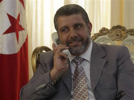 Religious Affairs Minister Noureddine Khadmi speaks on the phone at his office in Tunis September 2, 2013. REUTERS/Zoubeir Souissi