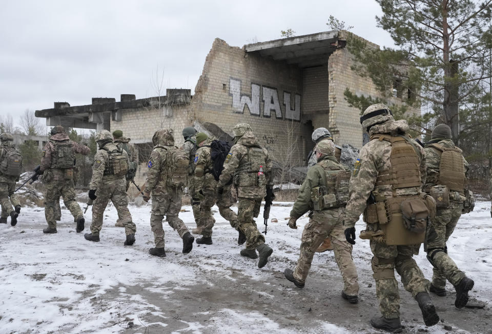 Members of Ukraine's Territorial Defense Forces, volunteer military units of the Armed Forces, train close to Kyiv, Ukraine, Saturday, Jan. 29, 2022. Dozens of civilians have been joining Ukraine's army reserves in recent weeks amid fears about Russian invasion. (AP Photo/Efrem Lukatsky)