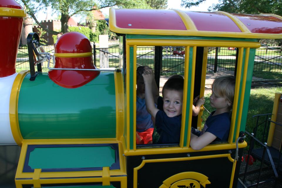 William Voeller, 4, serves as engineer during a train ride Monday morning at Storybook Land at Wylie Park. The park is always a popular destination on Independence Day.