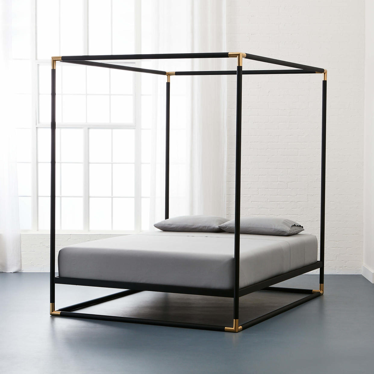 <p><a href="https://www.cb2.com/frame-black-iron-queen-canopy-bed/s178232" rel="nofollow noopener" target="_blank" data-ylk="slk:Shop Now;elm:context_link;itc:0;sec:content-canvas" class="link rapid-noclick-resp">Shop Now</a></p><p>Frame Black Iron Queen Canopy Bed</p><p>cb2.com</p><p>$699.00</p><span class="copyright">Courtesy of CB2</span>