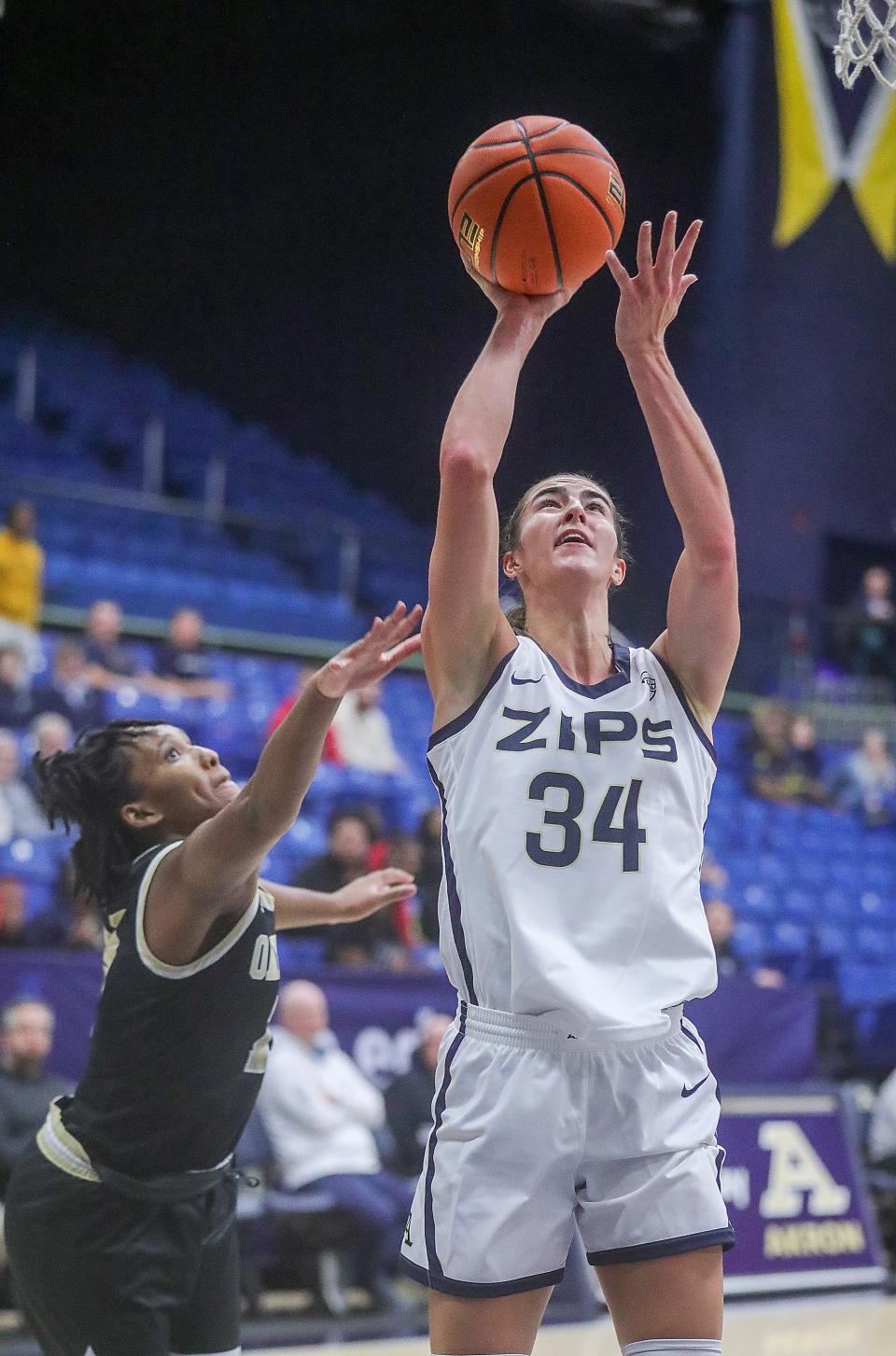 University of Akron forward Reagan Bass puts up a shot in the paint against Oakland on Monday in Akron.