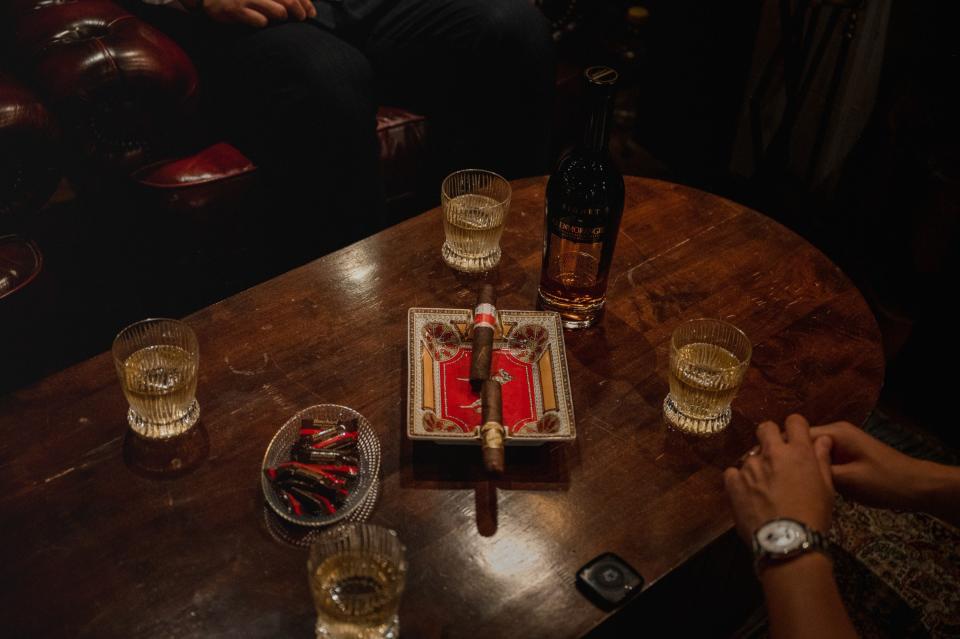 Whiskey and cigars sit on a table at the Garrison Cheongsam speakeasy bar in the Apgujeong neighborhood of the Gangnam district in Seoul, South Korea