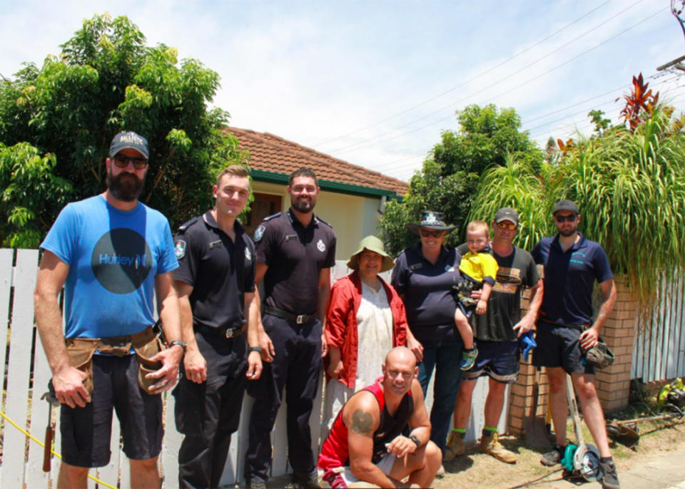 Left to right: Constable Ohara, First Year Constable Anderson, Constable Mcmanus, Anselma Edwards, Constable Jason Firth (below), Senior Sergeant Smith, Constable Graham, Constable Jones. Source: Queensland Police Service