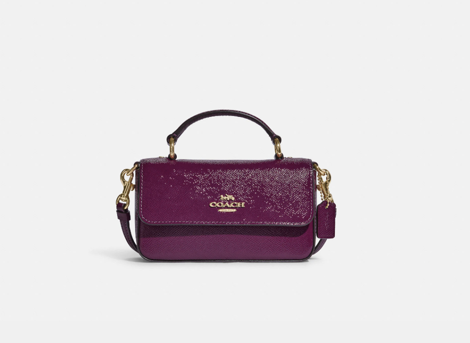 Mini Josie Top Handle Crossbody in dark magenta (Photo via Coach Outlet)