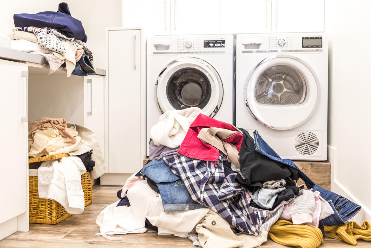 According to the U.S. Department of Labor, the average American consumer spends up to 375 hours a year sorting, washing, drying and folding laundry. (Photo: Getty Images)