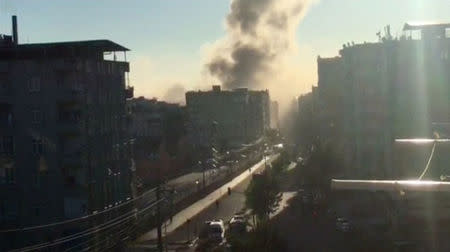 Smoke rises from an explosion in a central district of Diyarbakir, the largest city in Turkey's mainly Kurdish southeast, in this still image taken from video November 4, 2016. REUTERS/Reuters TV