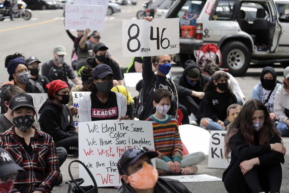 FILE - In this June 5, 2020, file photo, a protester holds a sign that reads "8:46" in Tacoma, Wash., during a protest against police brutality and the death of George Floyd, a black man who died after being restrained by Minneapolis police officers on May 25. For most police officers going on trial, the argument that they made a split-second decision in a life-or-death situation often carries significant weight for a jury. It's a reason officers are so rarely convicted. But it's an argument that's almost certainly not available to Derek Chauvin, the fired Minneapolis police officer who goes on trial Monday, March 29, 2021, in Floyd's death. (AP Photo/Ted S. Warren, File)