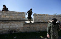 Turkish-backed Free Syrian Army fighters are seen as they advance north of Afrin, Syria March 17, 2018. REUTERS/Khalil Ashawi