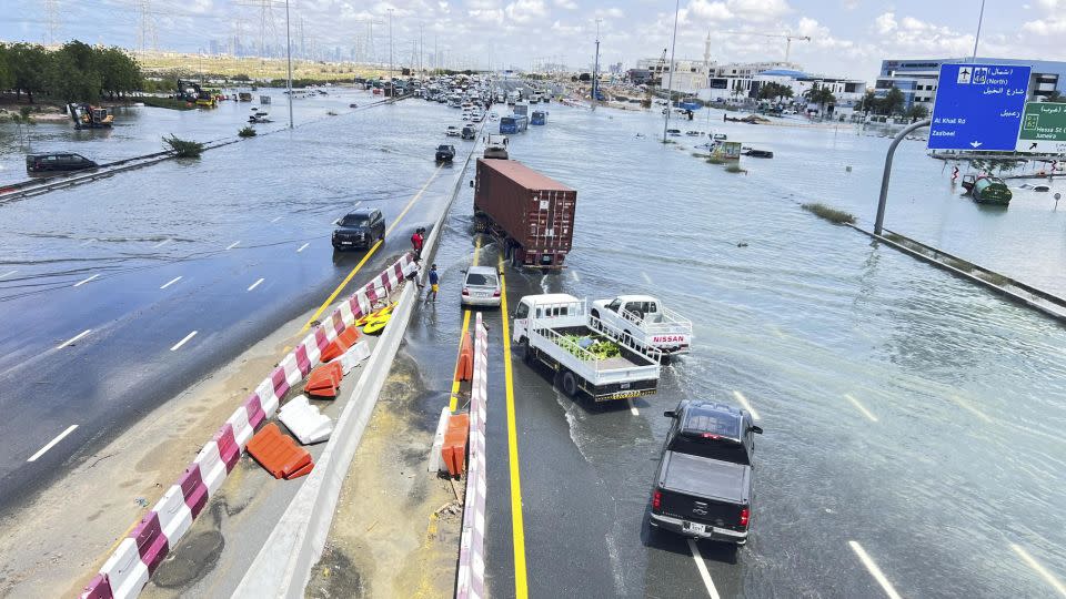 Cars are stuck on a flooded road after a rainstorm hit Dubai, United Arab Emirates on Wednesday. - Rula Rouhana/Reuters