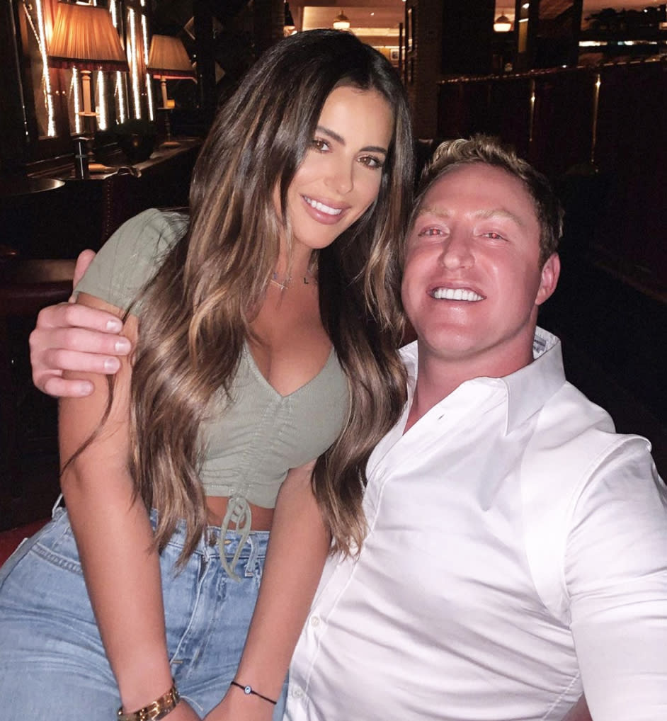 Brielle poses with stepdad Kroy Biermann sitting on lap in restaurant photo