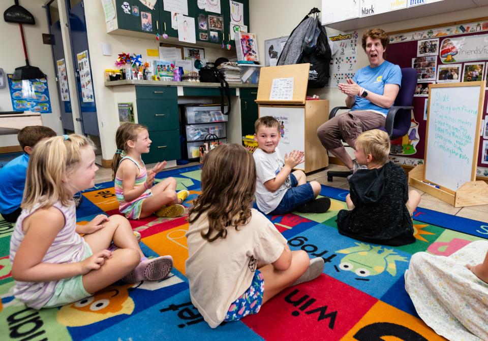 Joan Christnot, a teacher at Encompass Early Education & Care Inc., leads a group of young children in a song at the day care center in Allouez, Wis. on Monday, August 21, 2023. Seeger Gray/USA TODAY NETWORK-Wisconsin