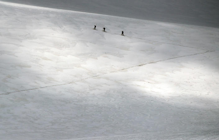 A group of scientists from the Austrian Institute for Interdisciplinary Mountain Research cross the Jamtalferner glacier near Galtuer, Austria. (Photo: Lisi Niesner/Reuters)
