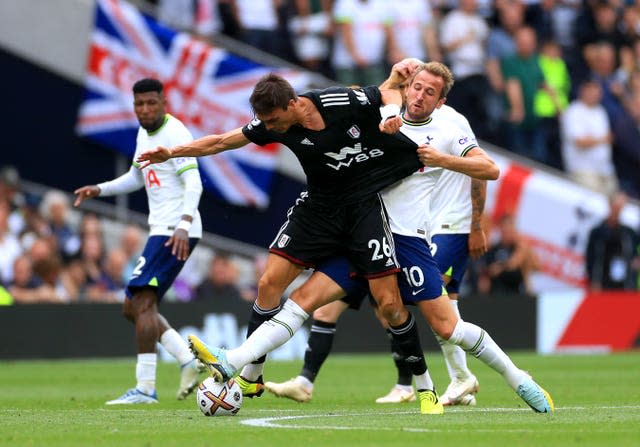 Joao Palhinha, left, and Harry Kane battle for the ball