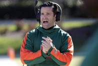 Miami head coach Manny Diaz encourages his team during the first half of an NCAA college football game against Duke, Saturday, Nov. 27, 2021, in Durham, N.C. (AP Photo/Chris Seward)