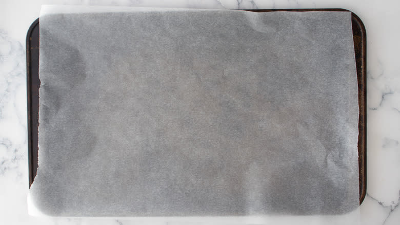 parchment paper lined baking sheet