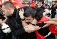 <p>Police detain a demonstrator during May Day protests in Istanbul, Turkey, May 1, 2018. Workers and activists mark May Day with defiant rallies and marches for better pay and working conditions. (Photo: Lefteris Pitarakis/AP) </p>