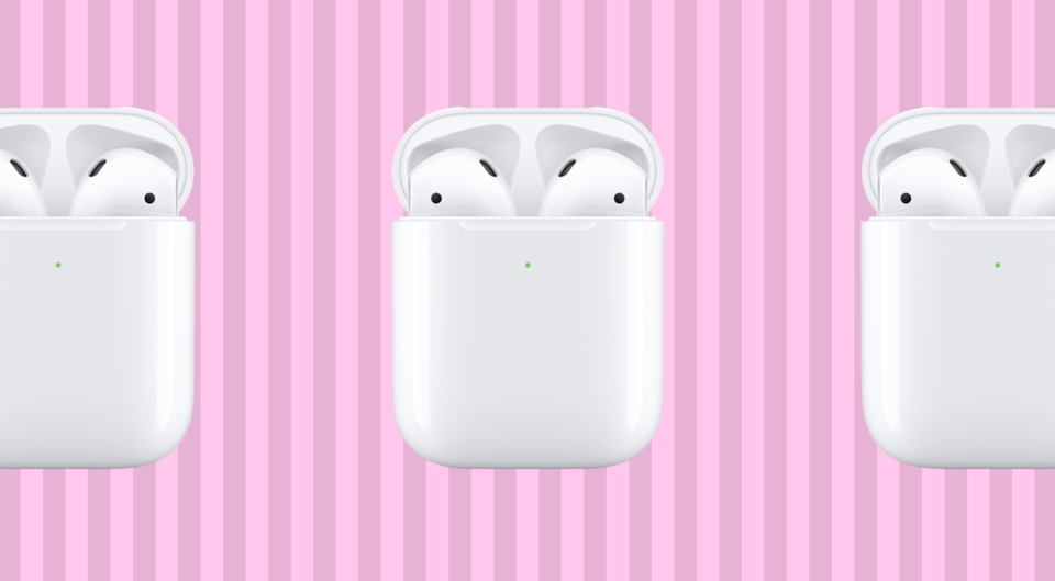 Apple AirPods on a pink background.