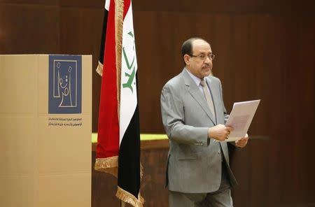 Iraq's Prime Minister Nuri al-Maliki prepares to vote during parliamentary election in Baghdad April 30, 2014. REUTERS/Ahmed Jadallah