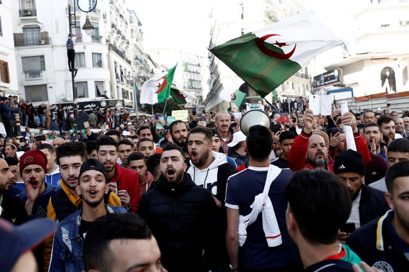 FILE PHOTO: Demonstrators take part in a protest to demand Algeria's presidential election scheduled for Dec. 12 be cancelled