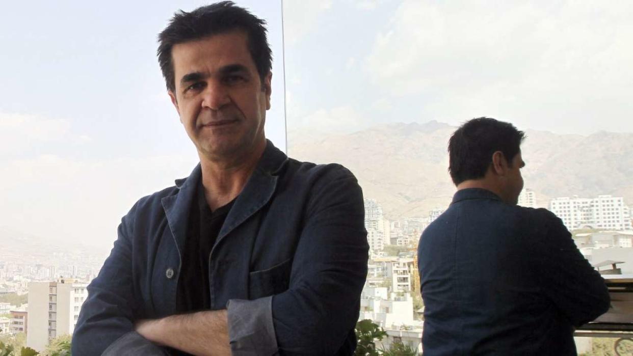 FILES - Picture taken on August 30, 2010 shows Iranian film director Jafar Panahi standing on a balcony overlooking Tehran during an interview with AFP. The International Film Festival Berlinale director Dieter Kosslick said on December 6, 2010 he had invited outspoken Iranian filmmaker Jafar Panahi, who was freed on bail after three months in a Tehran jail, to serve on its jury in February. The Cannes Film Festival had invited Panahi to join its own jury in May 2010 and the jury headed by 