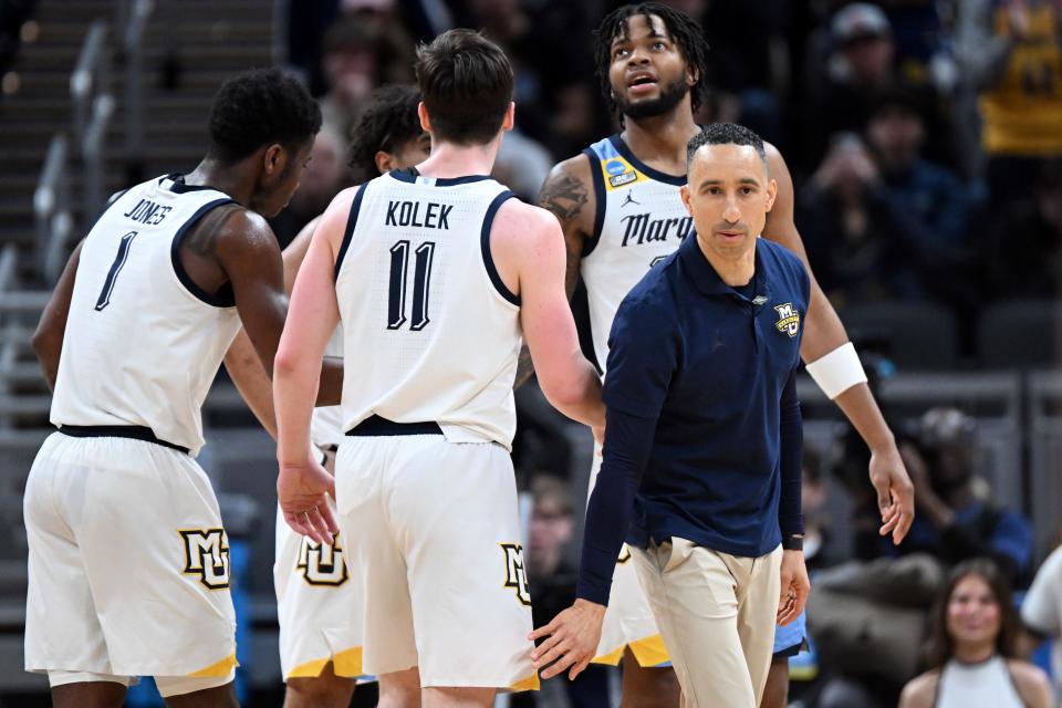 Mar 22, 2024; Indianapolis, IN, USA; Marquette Golden Eagles head coach Shaka Smart reacts with guard Tyler Kolek (11) in the second half against the Western Kentucky Hilltoppers in the first round of the 2024 NCAA Tournament at Gainbridge FieldHouse. Mandatory Credit: Robert Goddin-USA TODAY Sports