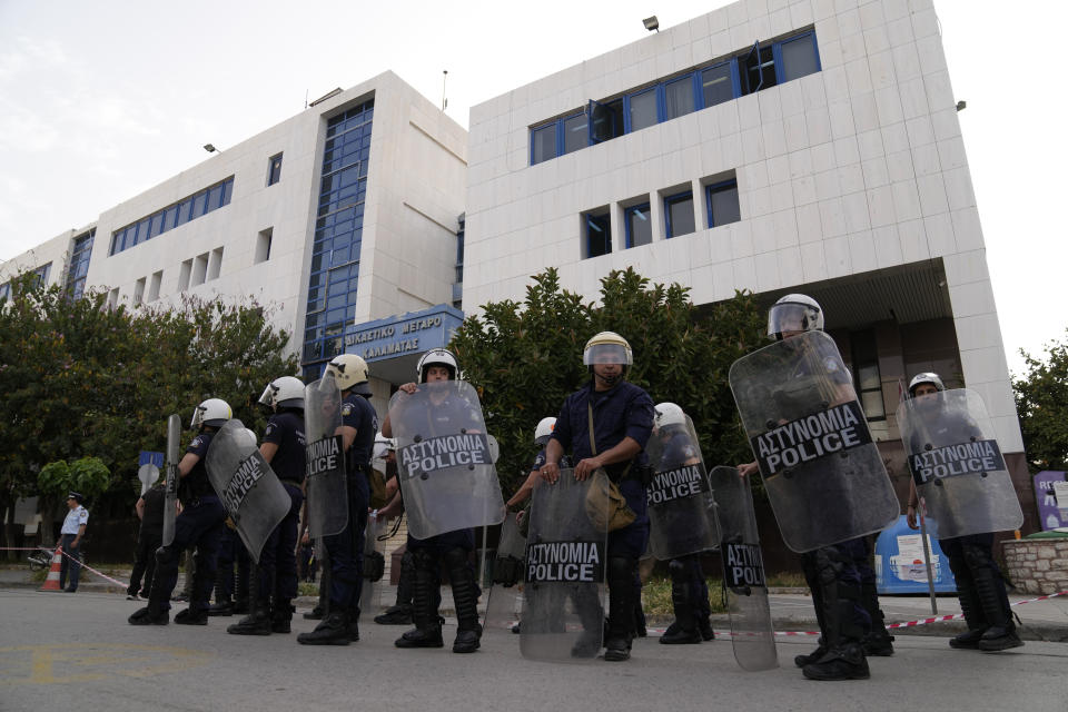 Police guard outside a court house in Kalamata, southwestern Greece, on Tuesday, May 21, 2024. Nine Egyptian men go on trial in southern Greece on Tuesday, accused of causing a shipwreck that killed hundreds of migrants and sent shockwaves through the European Union’s border protection and asylum operations. (AP Photo/Thanassis Stavrakis)