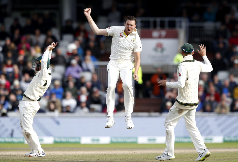 Australia's Josh Hazlewood celebrates taking the wicket of England's Jos Buttler during day five of the fourth Ashes cricket Test match at Old Trafford, Manchester, England, Sunday Sept. 8, 2019. (Martin Rickett/PA via AP)