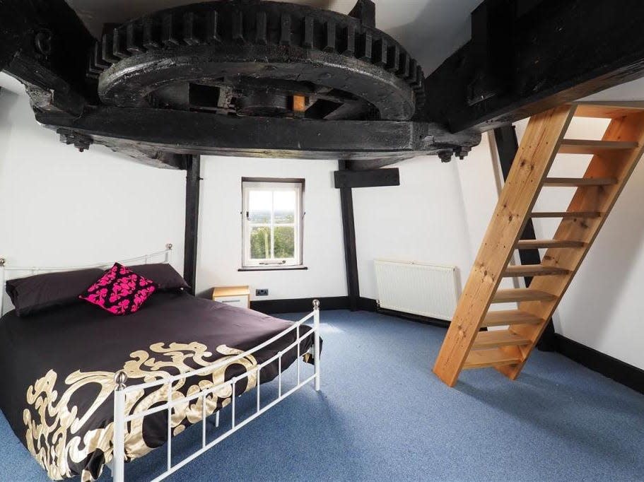 One of the bedrooms in the windmill. This bedroom is on the third floor and has a giant exposed cog on its ceiling.