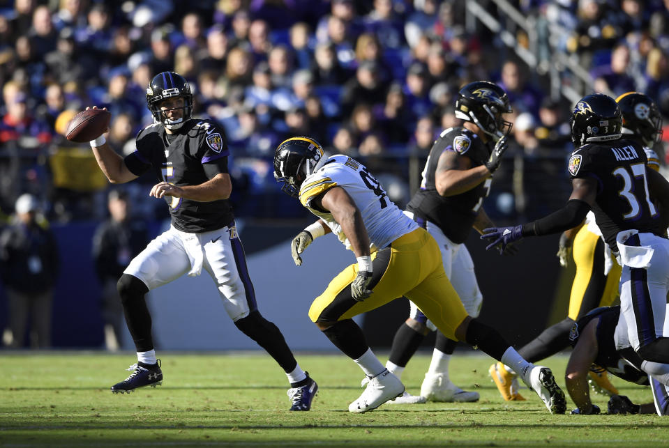 The Steelers’ Stephon Tuitt chases Baltimore’s Joe Flacco last Sunday. A Tuitt takedown reportedly led to a hip injury for Flacco. (AP)