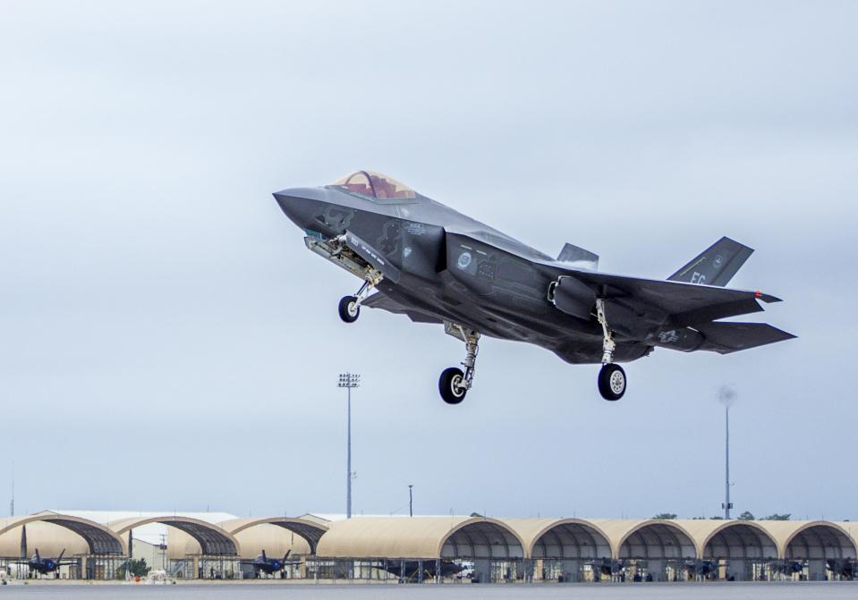 A fifth-generation F-35 Lightning II takes off from Eglin Air Force Base, which also hosts reprogramming laboratories for the fifth-generation fighter jet to update and improve software for use in the aircraft. A recent military contract award will cover work at reprogramming laboratories at Eglin serving the United Kingdom, Canada, Australia, Norway and Italy.