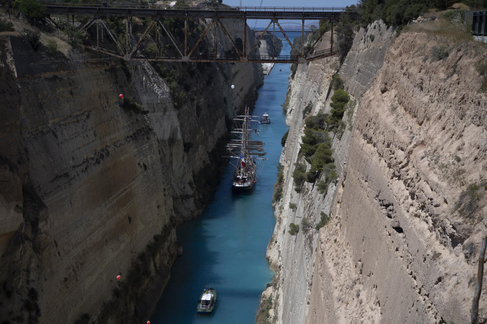 Belem, the three-masted sailing ship carrying the Olympic flame to France, is towed through the Corinth canal in Corinth, Greece, April 28, 2024. (AP Photo/Michael Varaklas)