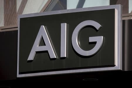 The AIG logo is seen at its building in New York's financial district March 19, 2015. REUTERS/Brendan McDermid