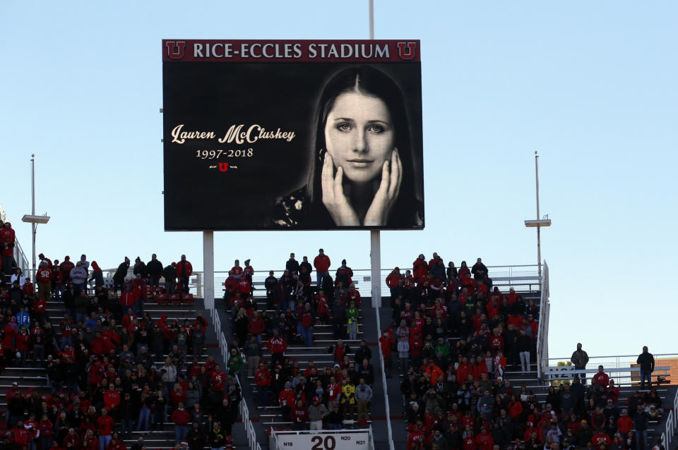 FILE - In this Nov. 10, 2018, file photo, a photograph of University of Utah student and track athlete Lauren McCluskey, who was fatally shot on campus, is projected on the video board before the start of an NCAA college football game between Oregon and Utah in Salt Lake City. The University of Utah is releasing audio recordings of phone calls made by McCluskey and her parents about an ex-boyfriend who had been sending harassing messages and later killed her. (AP Photo/Rick Bowmer, File)