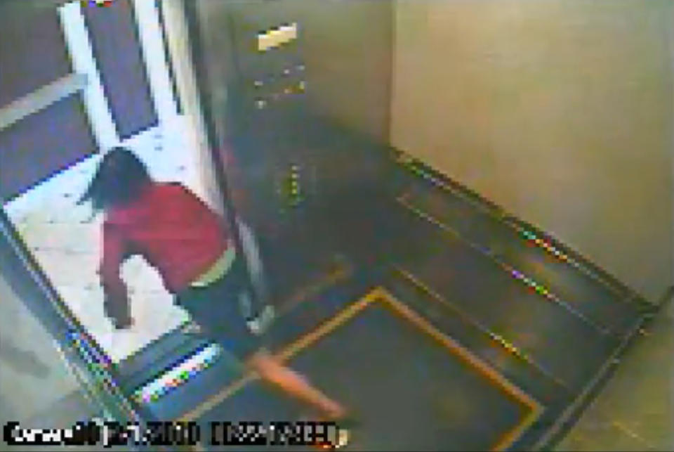 This still image taken from a security video was released on Feb. 13, 2013, by the Los Angeles Police Department in connection with the search for 21-year-old missing Canadian tourist Elisa Lam. In this image, a woman believed to be Lam quickly peeks out the door of an elevator before jumping back inside in the Cecil Hotel in downtown Los Angeles on Thursday, Jan. 31, the last day she was seen alive. A maintenance worker at the hotel found Lam's body in a water cistern on the building's roof on Feb. 19, more than two weeks after she had gone missing. (AP Photo/Los Angeles Police Department)