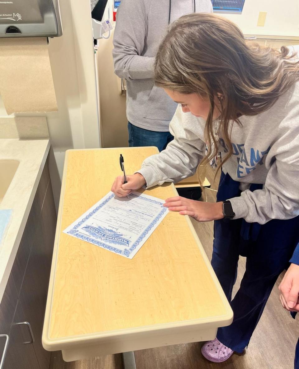 PHOTO: Two Saint Luke’s East Hospital nurses served as the Perrys’ witnesses and signed their marriage license. (Courtesy of Saint Luke’s East Hospital)