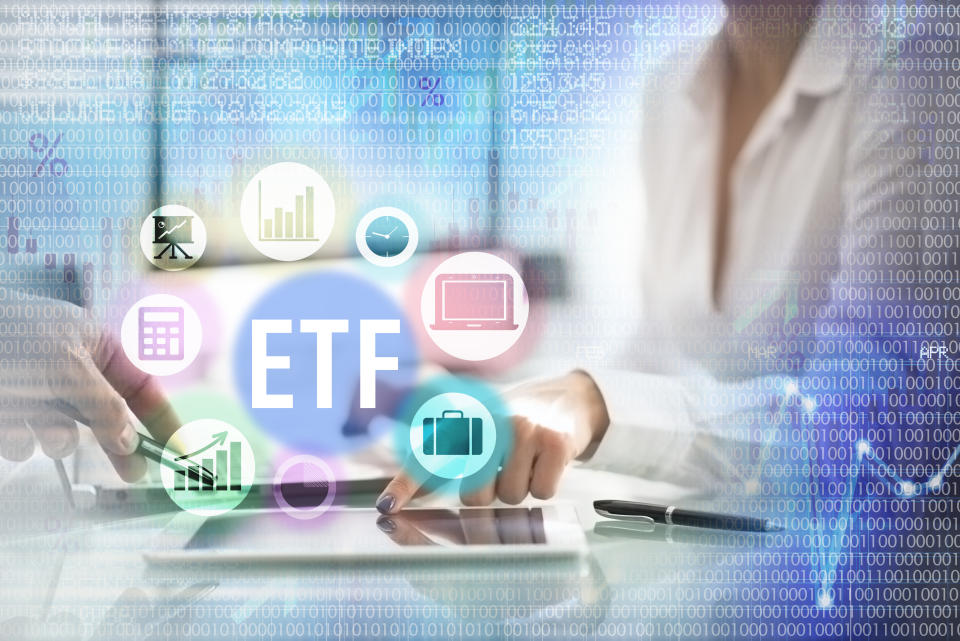 ETF Investment index funds concept with business woman hand showing graph evolution of stocks on a tablet