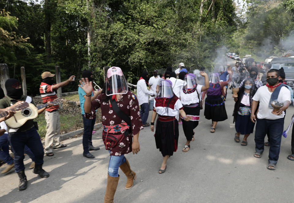 Members of the Zapatista Army of National Liberation, EZLN, bid farewell to a delegation that will leave for Europe on May 3, in the community of Morelia, Chiapas state, Mexico, Monday, April 26, 2021. The rebels say they are planning to take canoes on a trip to ‘invade’ Spain in May and June, as Mexico marks the anniversary of the 1519-1521 Spanish Conquest of Mexico. (AP Photo/Eduardo Verdugo)