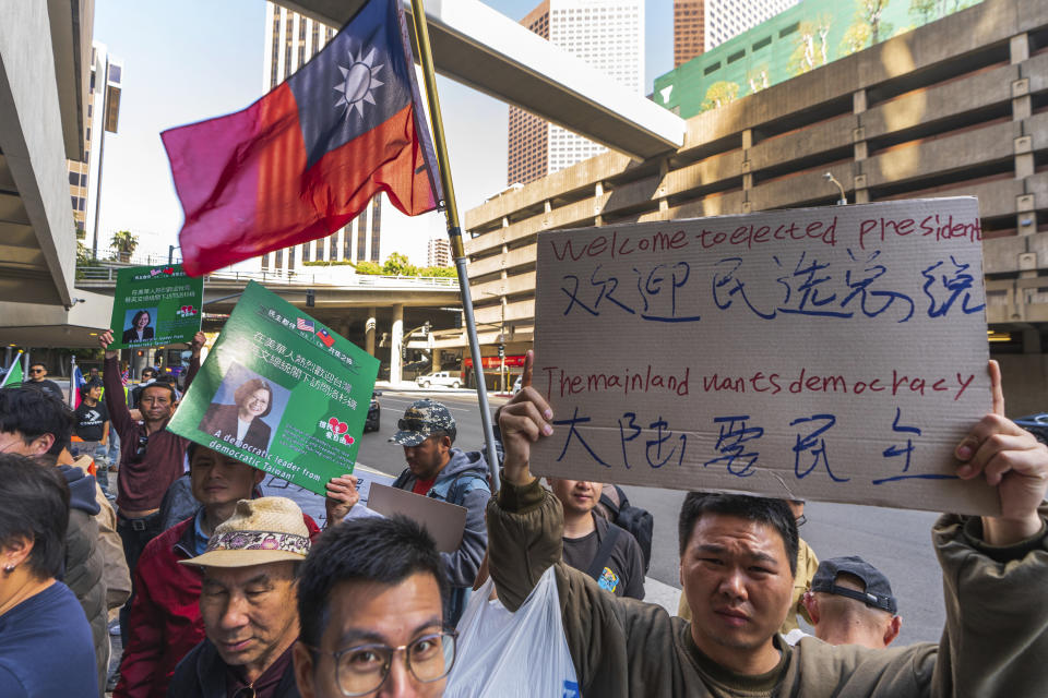 Supporters of Taiwan's President Tsai Ing-wen wait for her arrival outside The Westin Bonaventure Hotel in Los Angeles Tuesday, April 4, 2023. (AP Photo/Damian Dovarganes)