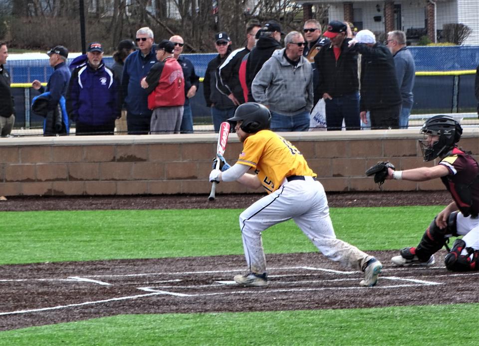 Lancaster senior David Roby prepares to lay down a bunt during the Golden Gales' 3-1 non-conference victory over Licking Heights on Saturday at Dick England Field.