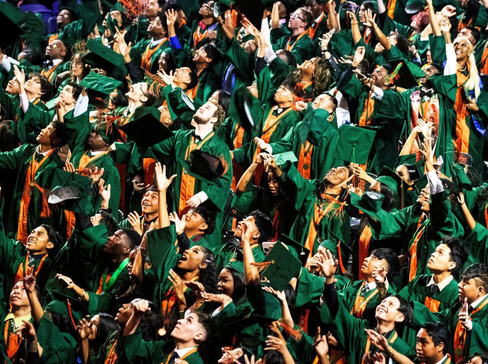 Dunbar High School graduates celebrate during commencement at Suncoast Credit Union Arena in Fort Myers on Sunday, May 19, 2024. The approximately 360 seniors at the high school were among 6,000 Lee County School District students graduating this year.