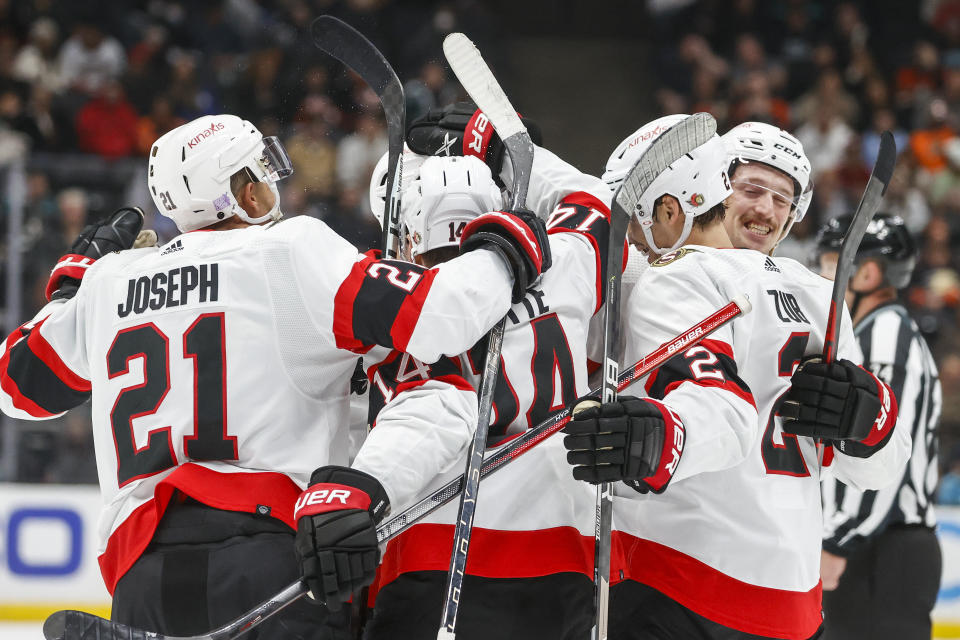 Ottawa Senators defenseman Artem Zub, second from right, celebrates his goal with teammates during the second period of an NHL hockey game against the Anaheim Ducks Friday, Nov. 25, 2022, in Anaheim, Calif. (AP Photo/Ringo H.W. Chiu)