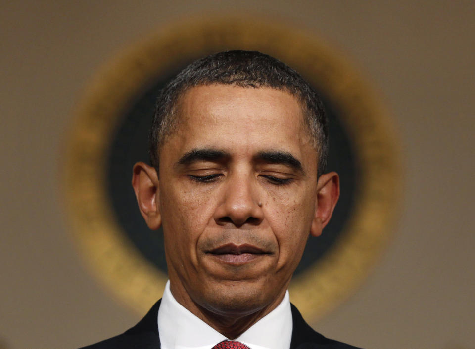 President Barack Obama pauses as he speaks to the media following televised remarks made by Egyptian President Hosni Mubarak in the Grand Foyer of the White House in Washington, February 1, 2011. President Obama on Tuesday said President Mubarak recognized a change must take place in his country. REUTERS/Larry Downing