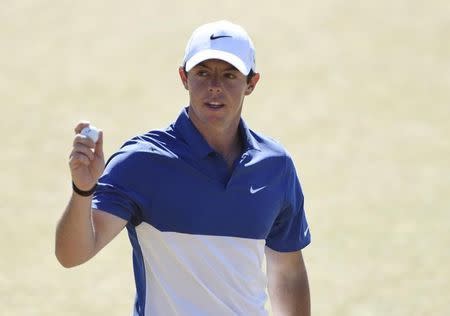 Jun 21, 2015; University Place, WA, USA; Rory McIlroy waves to the crowd after putting on the 18th green in the final round of the 2015 U.S. Open golf tournament at Chambers Bay. Mandatory Credit: Kyle Terada-USA TODAY Sports