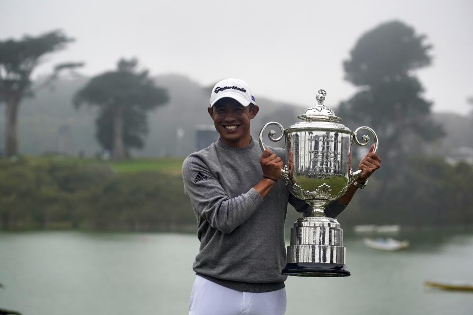 FILE - Collin Morikawa holds the Wanamaker Trophy after winning the PGA Championship golf tournament at TPC Harding Park in San Francisco, in this Sunday, Aug. 9, 2020, file photo. Morikawa tries to join Tiger Woods and Brooks Koepka as repeat winners in stroke play next week at the PGA Championship at Kiawah Island. (AP Photo/Jeff Chiu, File)