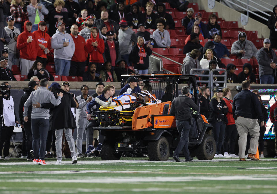 LOUISVILLE, KENTUCKY - NOVEMBER 09: Perris Jones #2 of the Virginia Cavaliers is taken off the field after being injured in the game against the Louisville Cardinals at Cardinal Stadium on November 09, 2023 in Louisville, Kentucky. (Photo by Andy Lyons/Getty Images)
