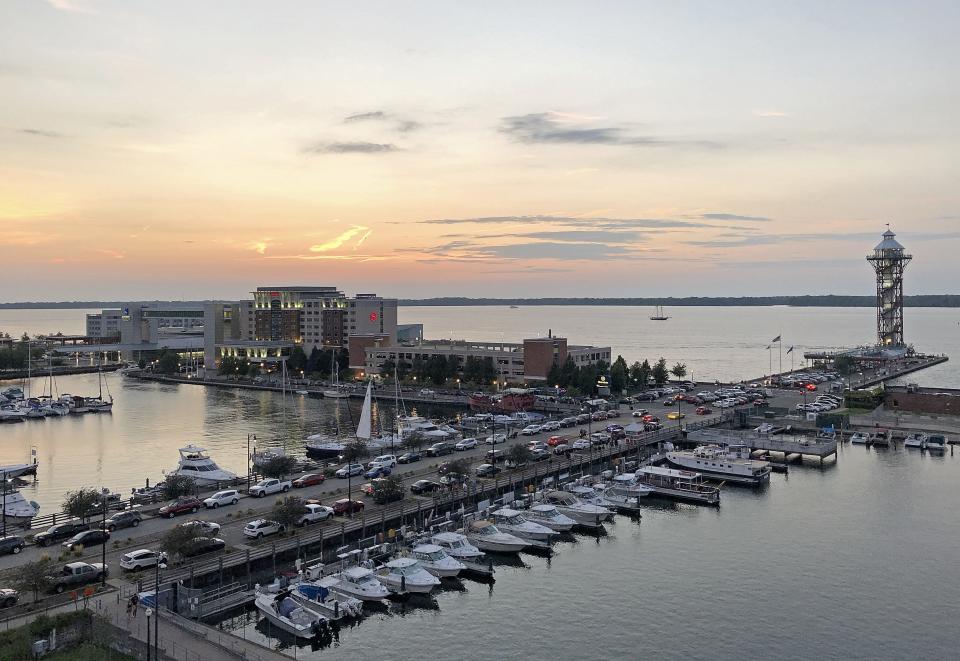 The Sheraton Erie Bayfront Hotel, center, left, and the Bicentennial Tower are shown on Aug. 27. The addition in recent years of numerous wineries, a long list of breweries, Splash Lagoon Indoor Water Park, Presque Isle Downs & Casino, the Bayfront Convention Center and four bayfront hotels all have contributed to Erie's appeal for tourists.