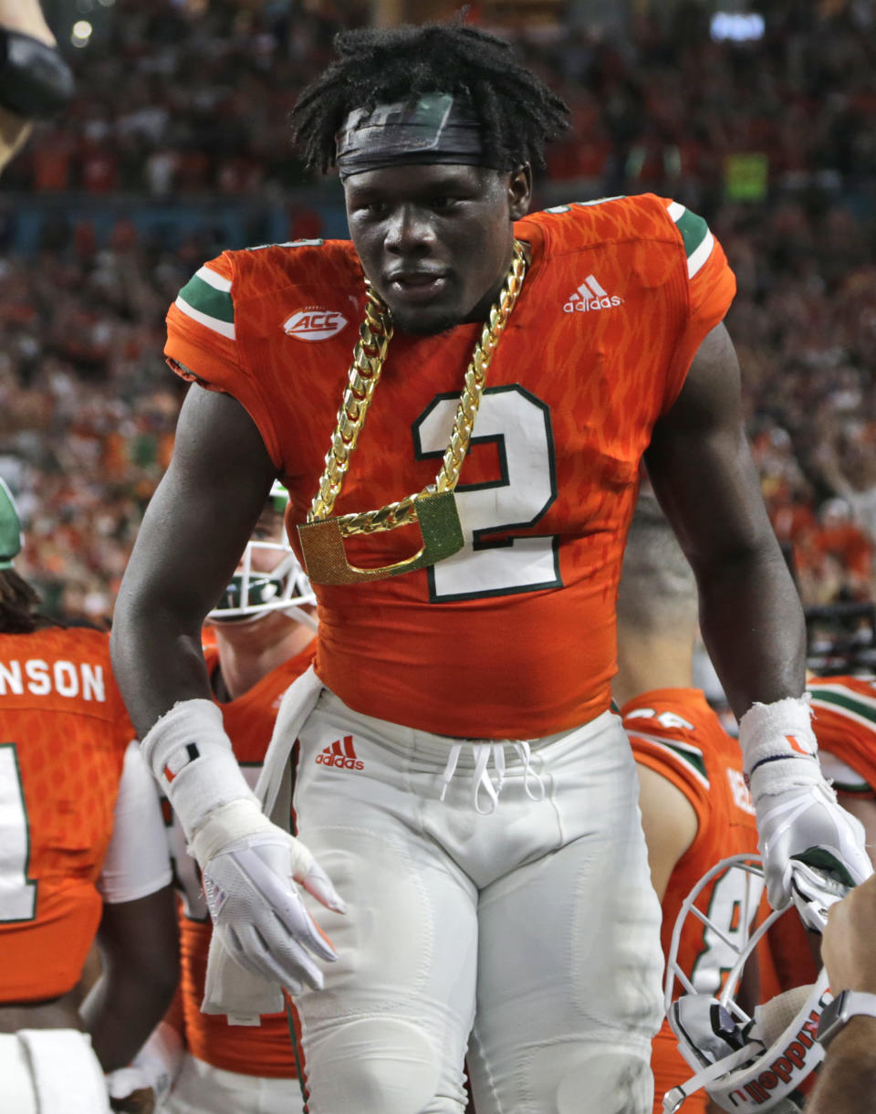 Miami defensive back Trajan Bandy (2) wears the turnover chain after getting an interception during the first half of an NCAA college football game against Notre Dame, Saturday, Nov. 11, 2017, in Miami Gardens, Fla. (AP Photo/Lynne Sladky)